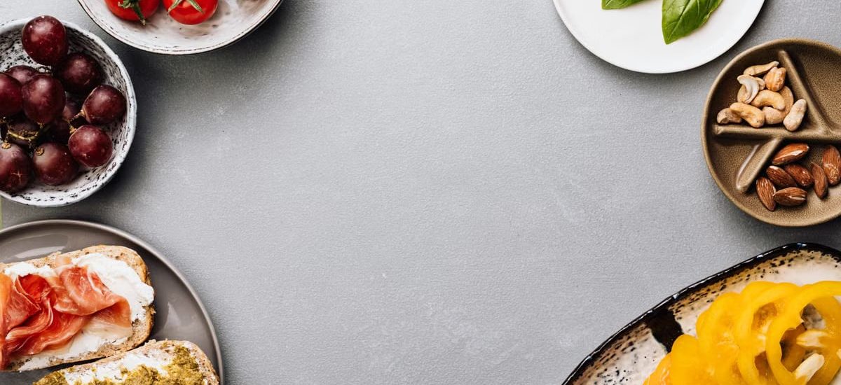 Fresh ingredients with sandwiches in a flat lay style, offering a gourmet meal concept.